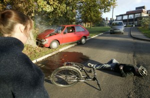 A woman surveys the scene of a car accident demonstration as part of the Life Live it campaign - uk-256-20